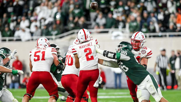 Adrian Martinez pass under pressure Jacub Panasuik 2021 Michigan State offensive line USATSI_16830445